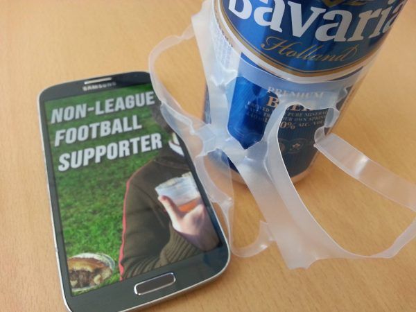 Photograph of a phone showing NLFS next to a can of lager